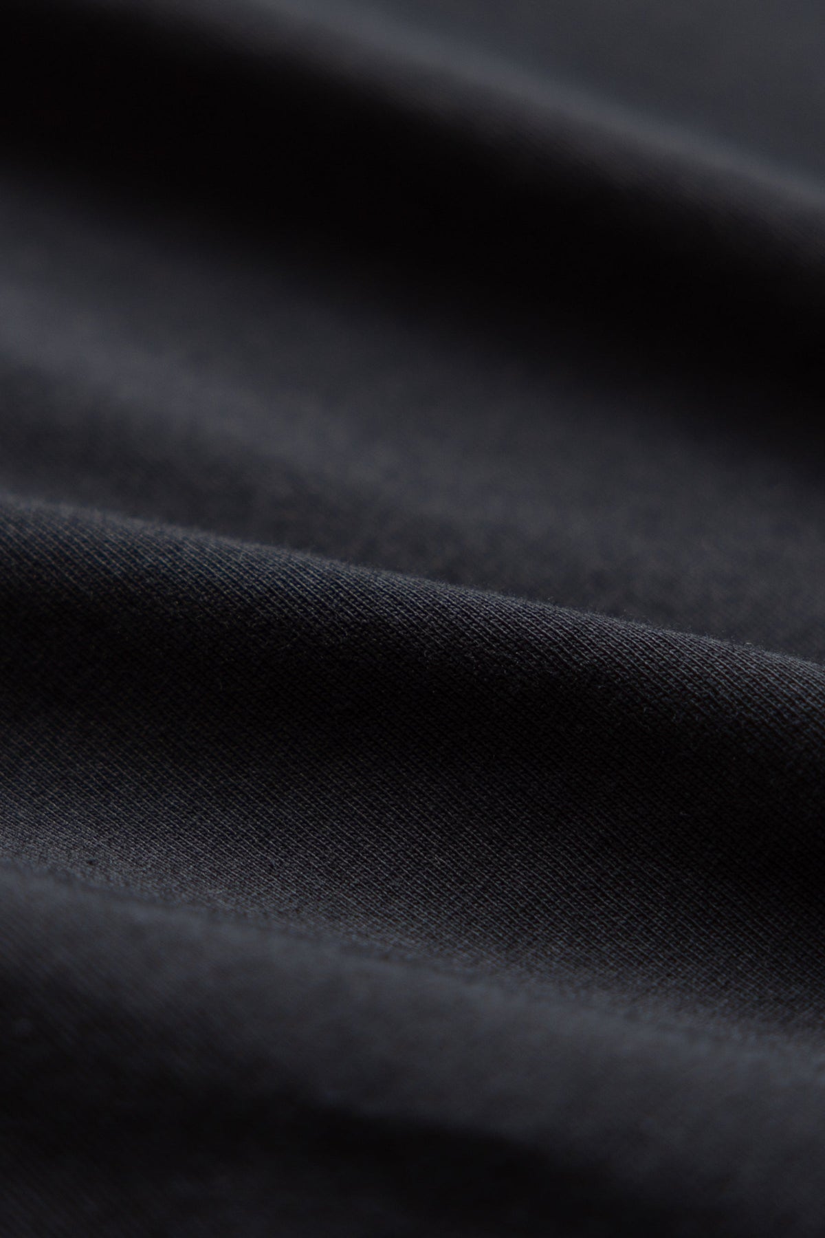 Close-up of black organic cotton t-shirt#color_black