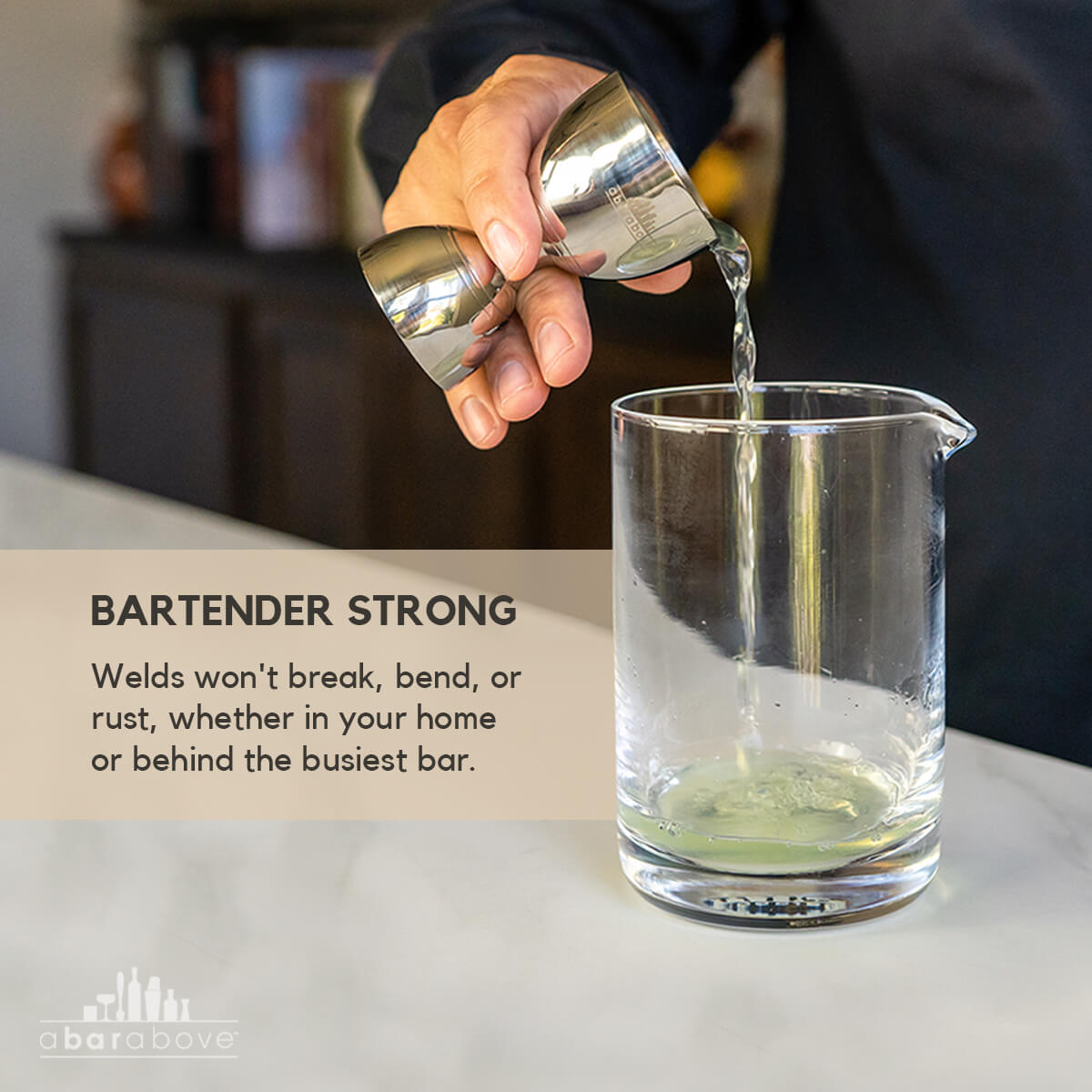 Feature graphic illustrating the Bell Jigger's strength and durable welds with a person pouring a drink (details in description).