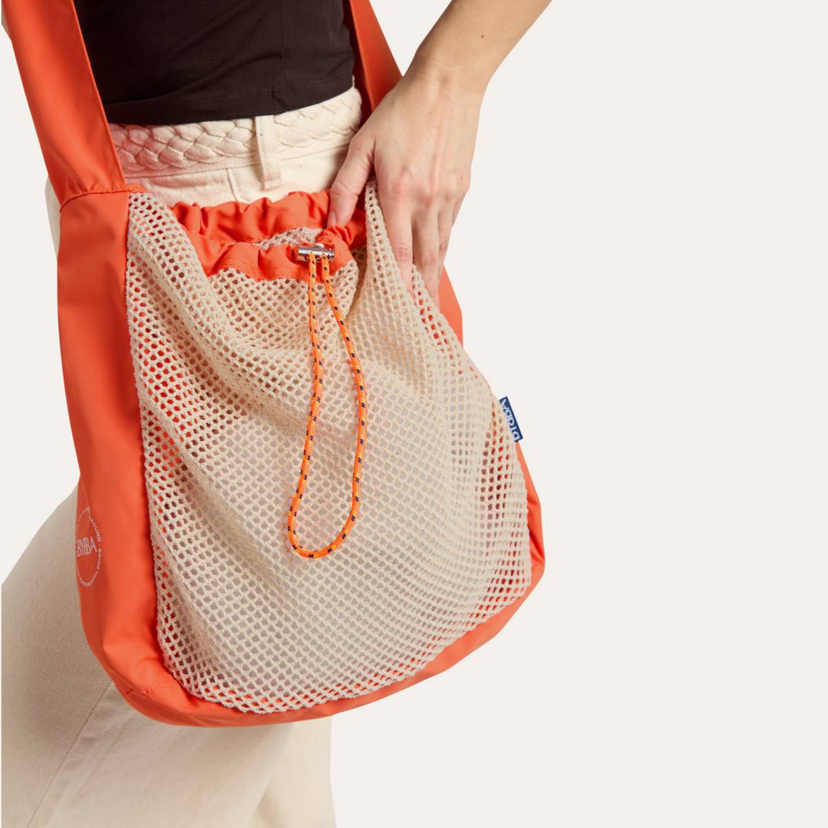 THE NET.ZERO MODERN FISHERMAN CROSSBODY BAG / CONCH