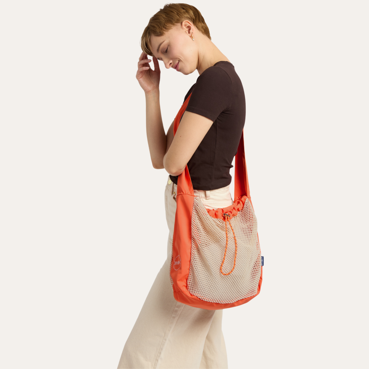 THE NET.ZERO MODERN FISHERMAN CROSSBODY BAG / CONCH