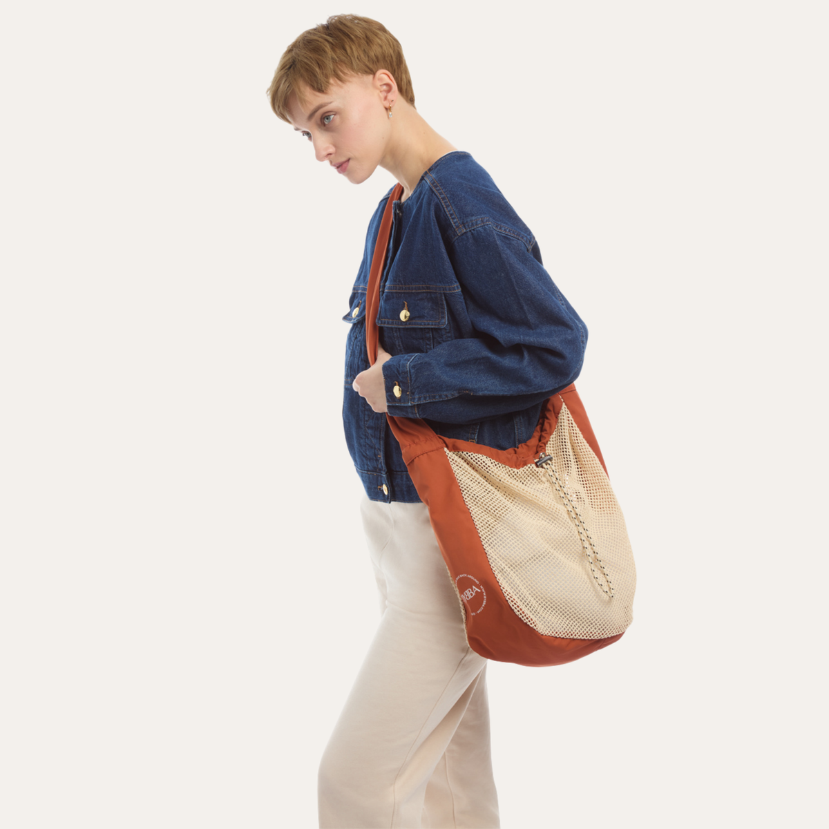 THE NET.ZERO MODERN FISHERMAN CROSSBODY BAG / RUST