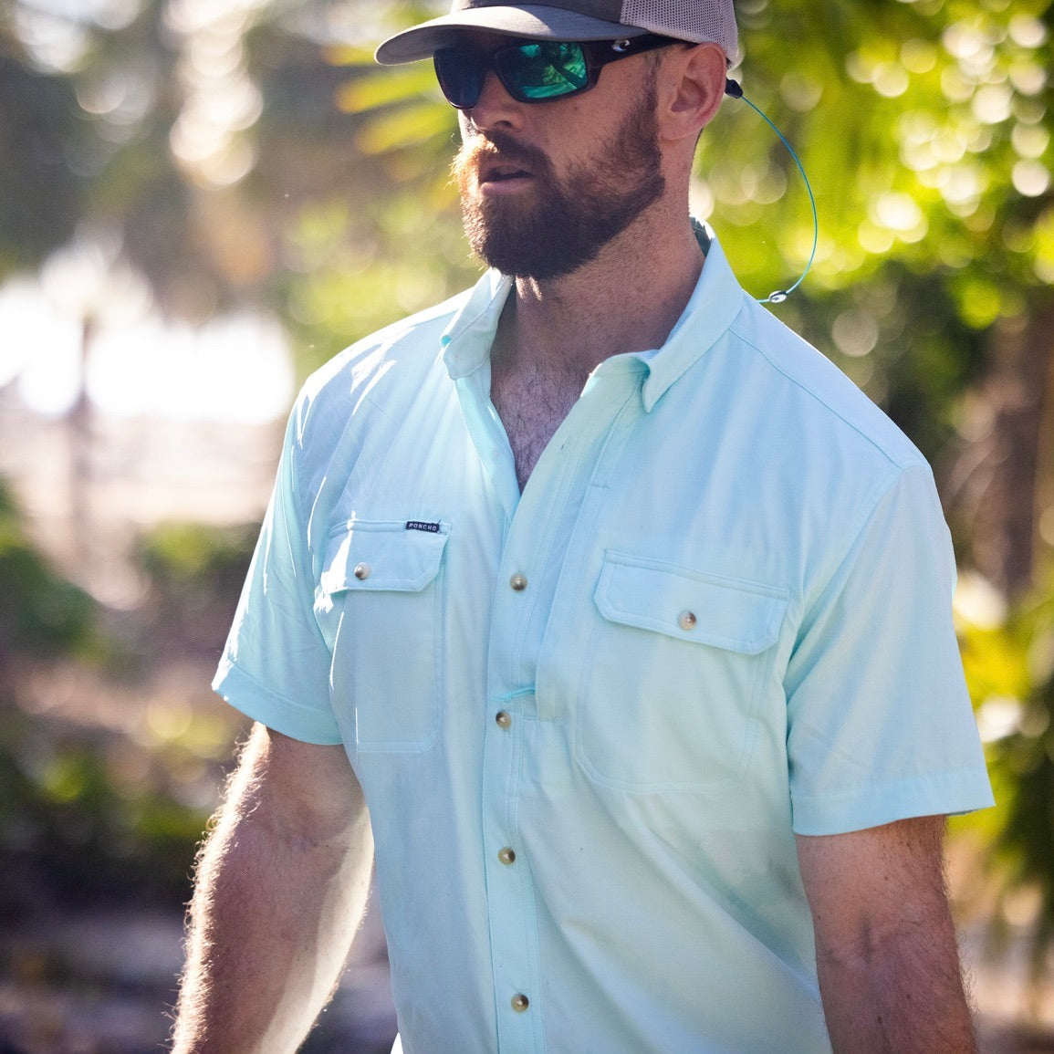man wearing light green short sleeve shirt