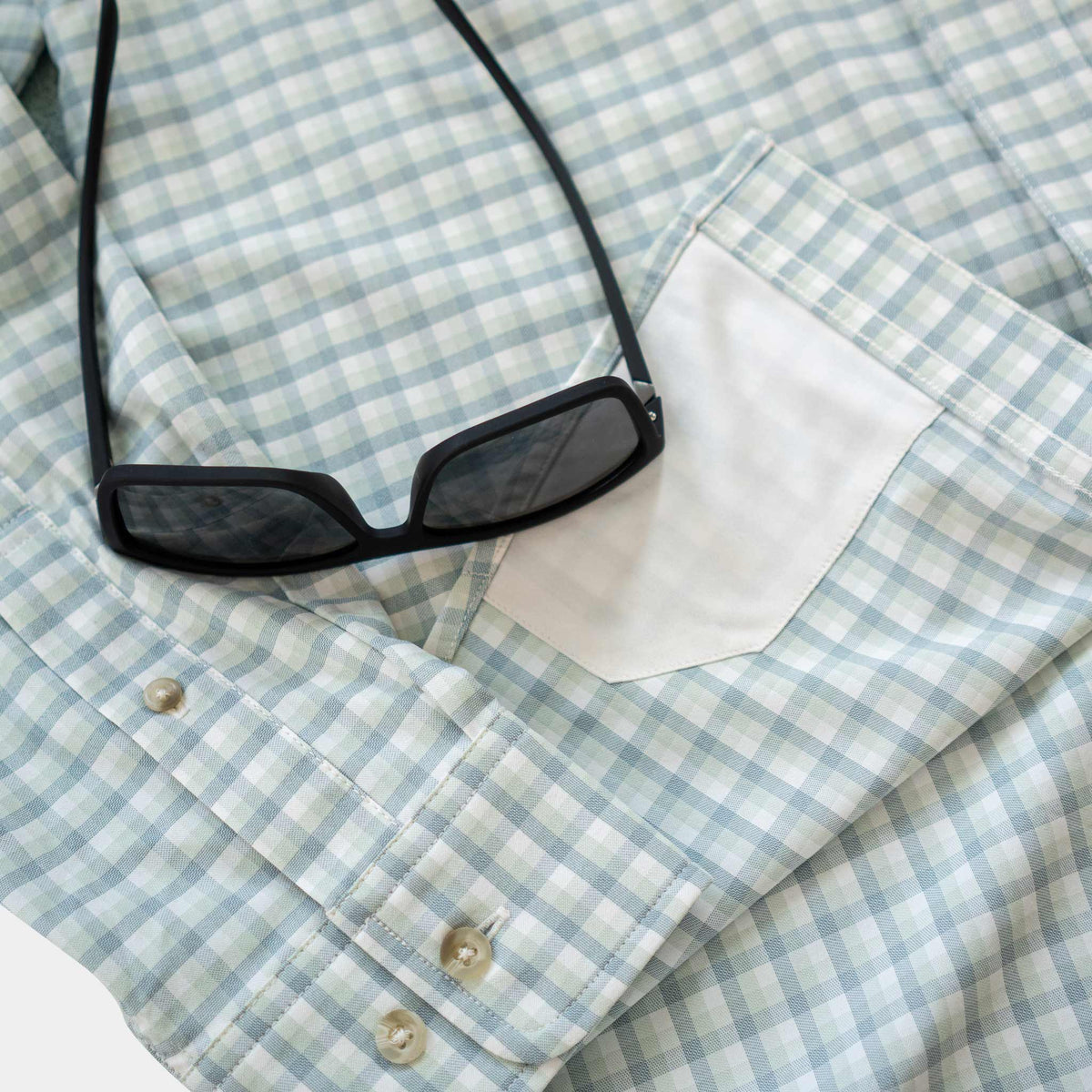 Close up lens of sunglasses on shirt