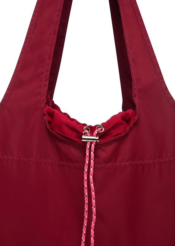 close up of drawstring of rich red pouch