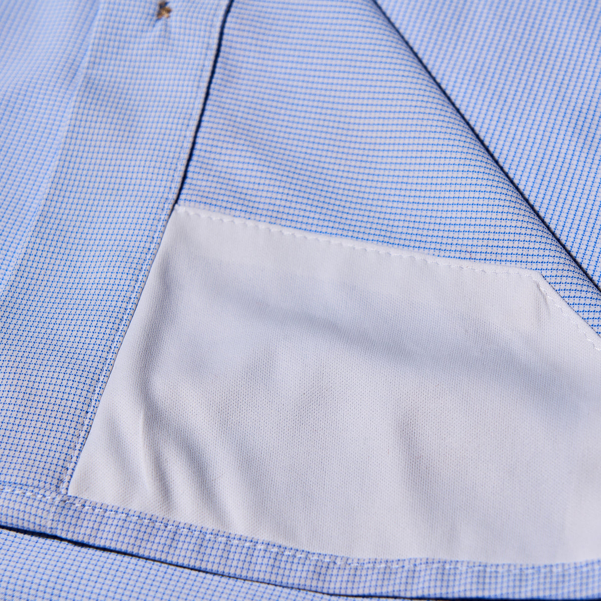 sunglass cleaner on blue and plaid microcheck shirt
