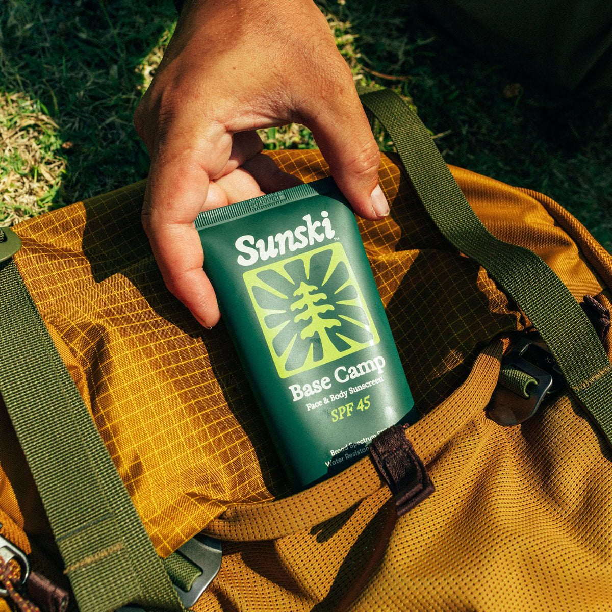 Base Camp SPF 45 sunscreen in a backpack