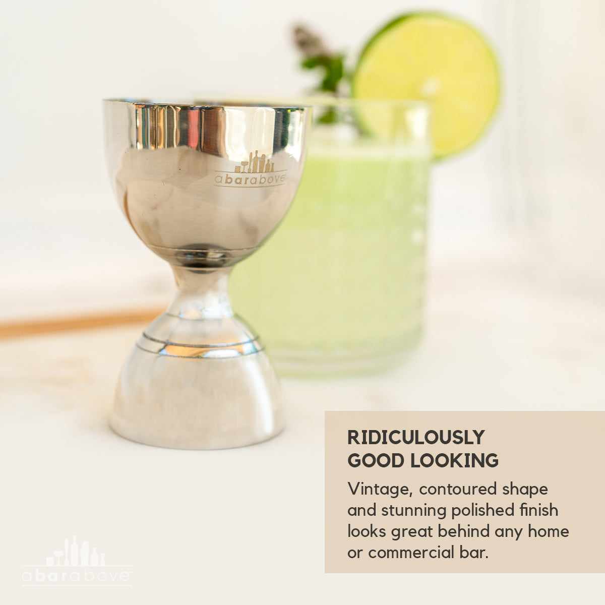 Infographic showing a stainless steel Bell Jigger with feature callouts highlighting its vintage, contoured shape and polished finish (details in description).