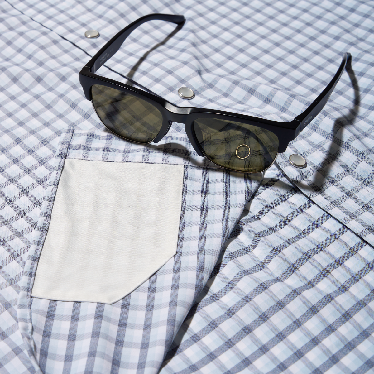closeup of blue plaid sunglasses cleaner