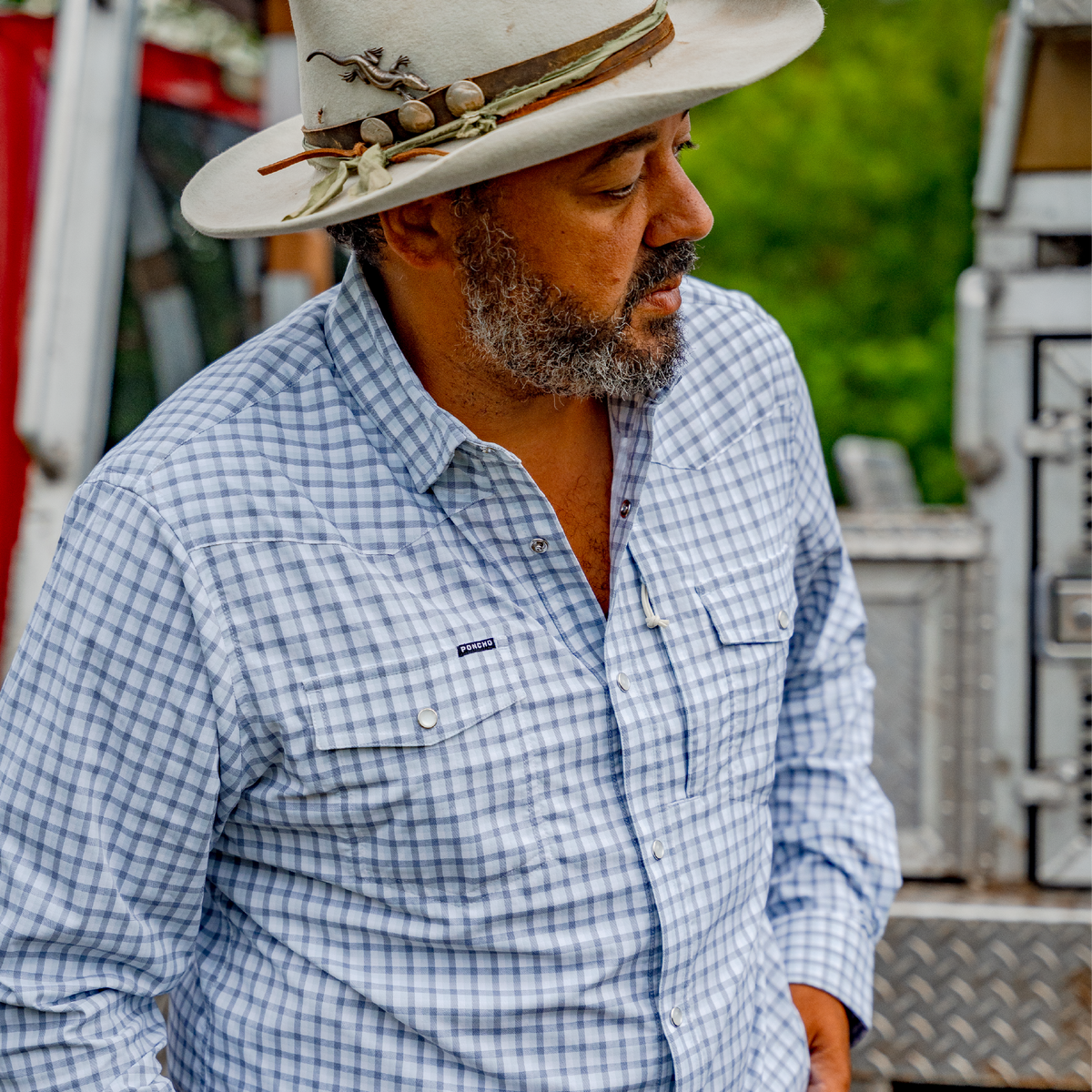 man wearing blue plaid shirt