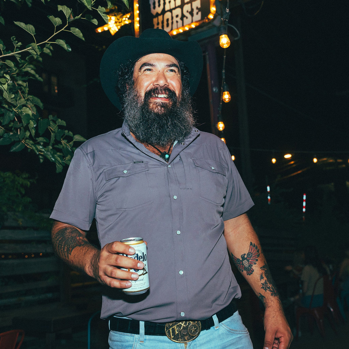 Man standing outside of bar in Cabrito