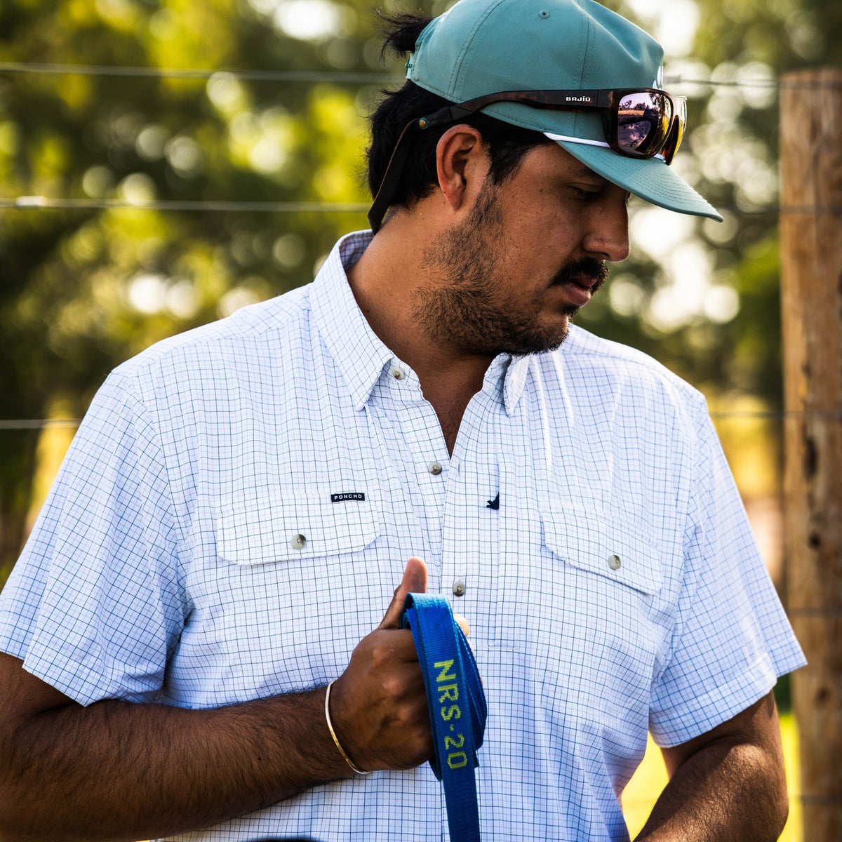 The Cattleman men's Double Blue Check fishing button-down shirt with short sleeves and dual chest pockets