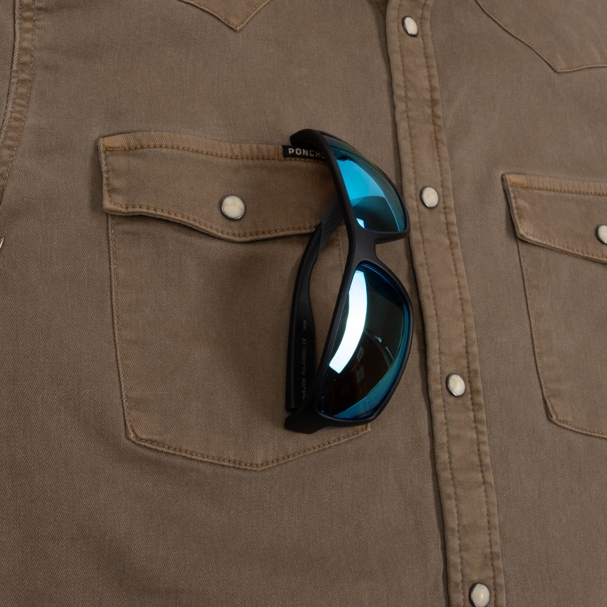 Glasses in Glasses holder on Cotulla Shirt
