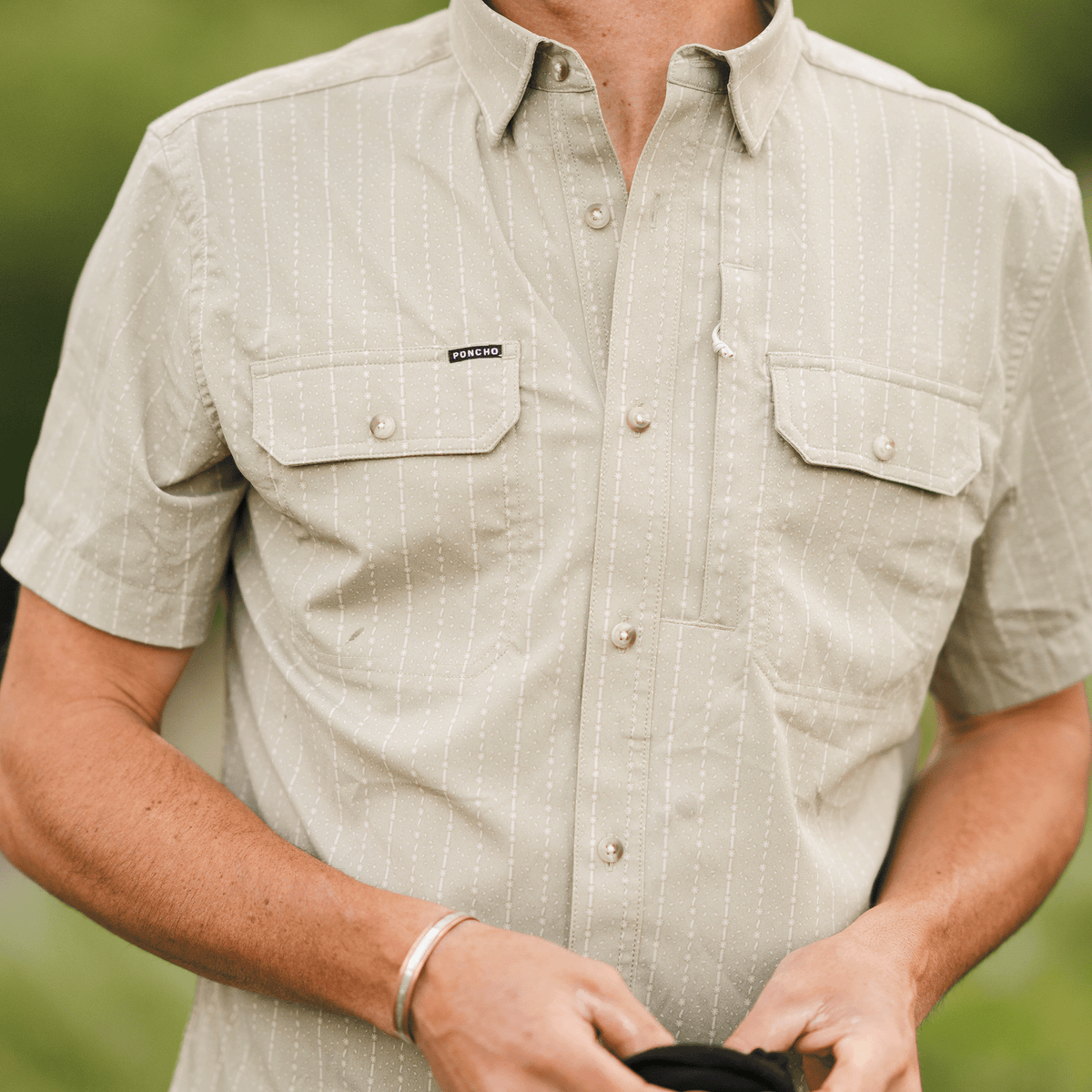 Close up of button down green shirt
