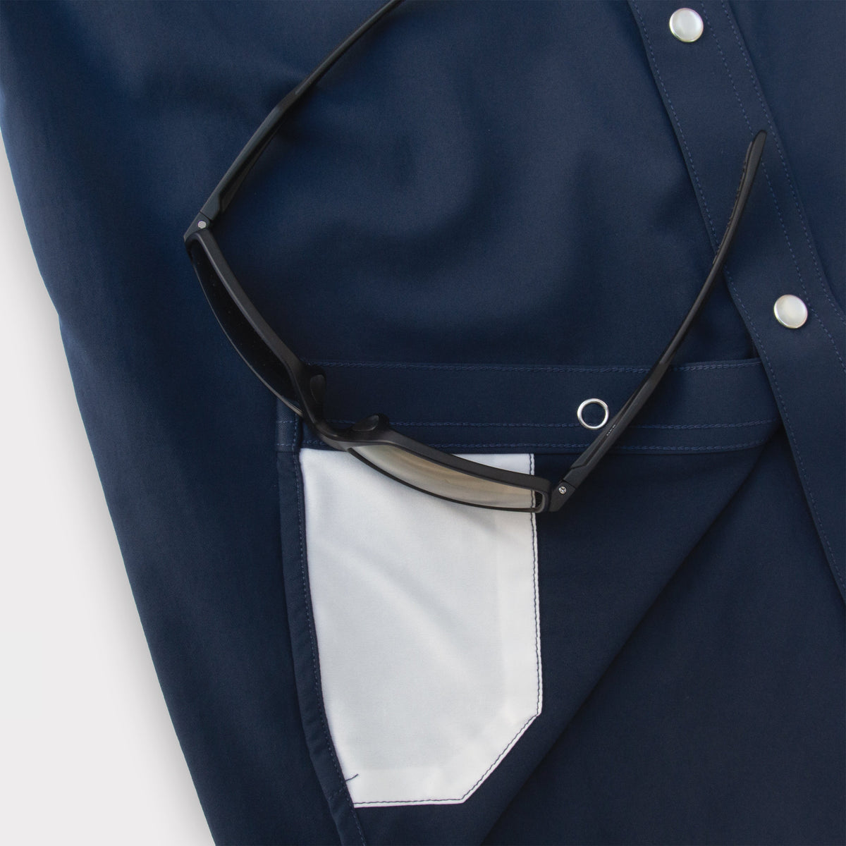 closeup of navy shirt sunglass cleaner