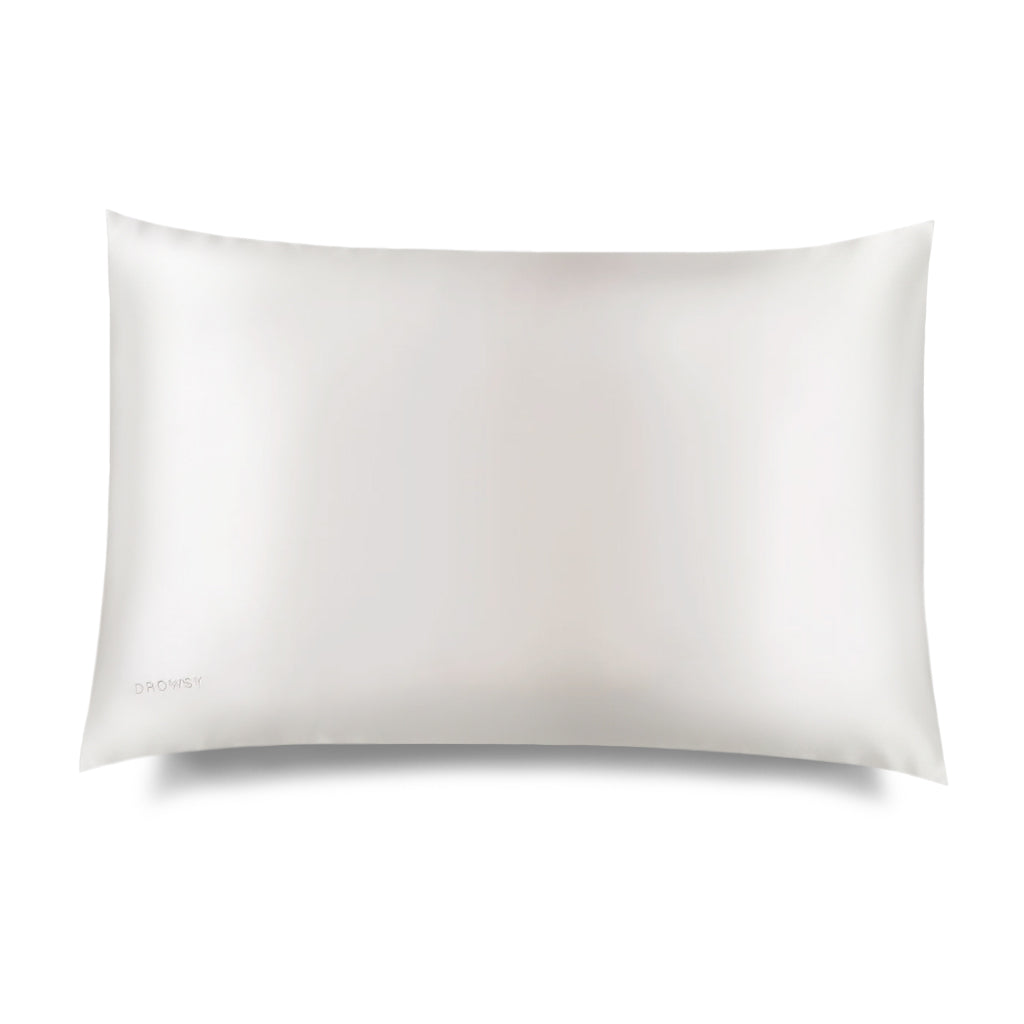White coloured silk pillow case on white background
