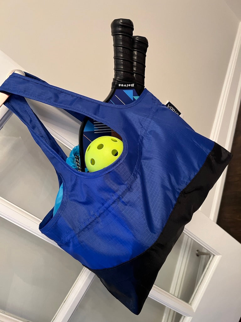 Blue pickle ball bag filled with paddle and balls