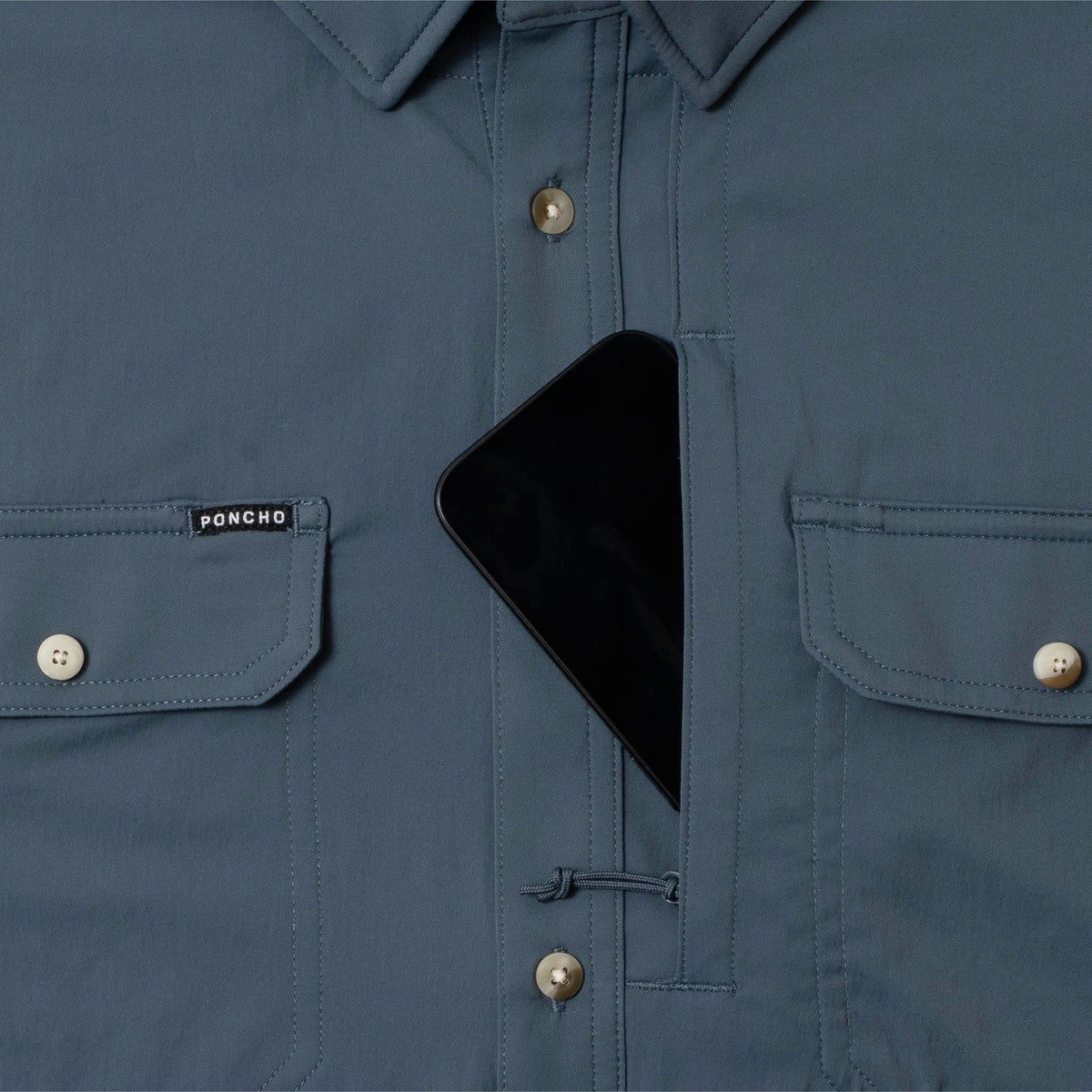 photo of shirt with phone in zipper pocket