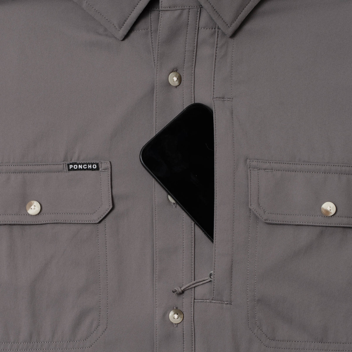 photo of shirt with phone in zipper pocket