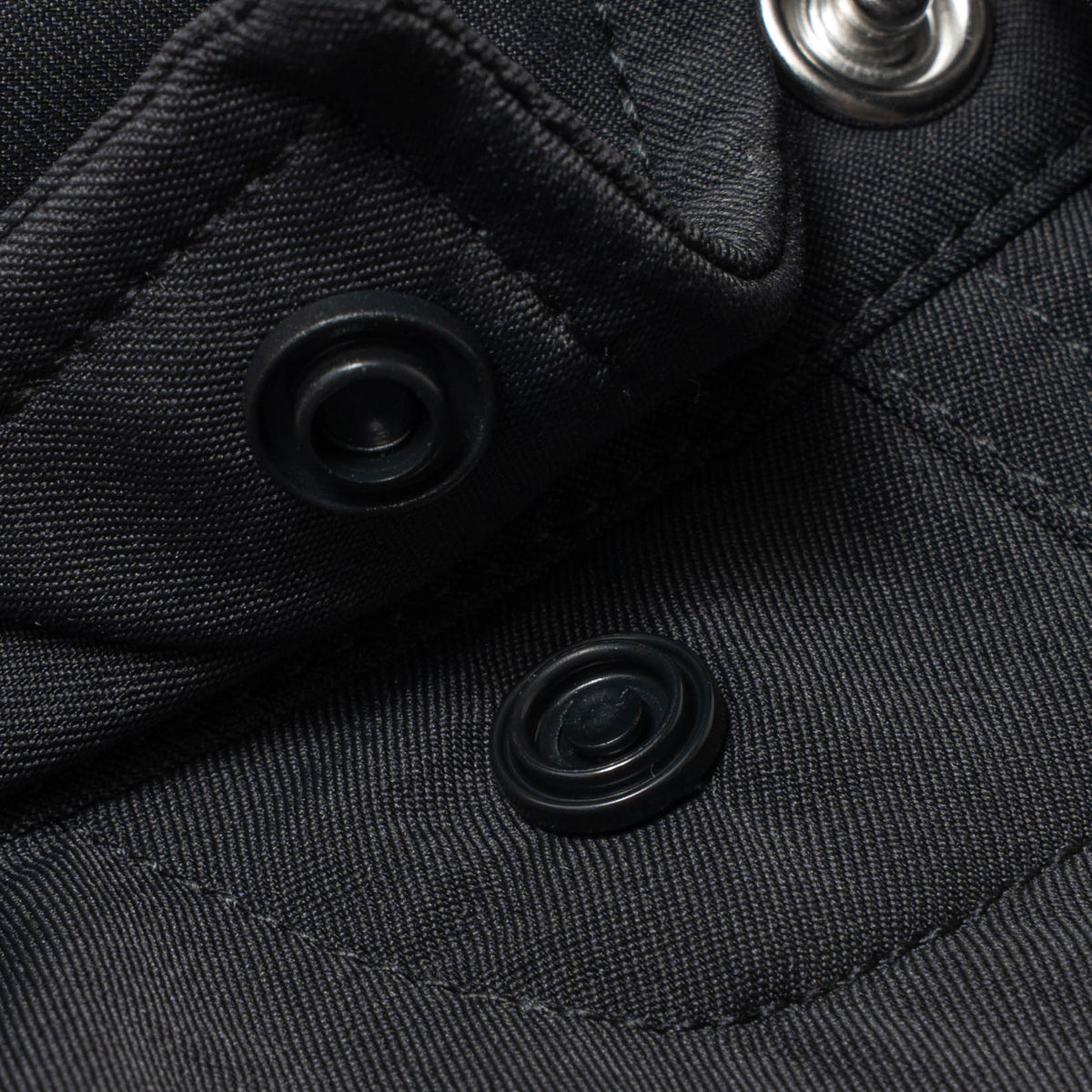 photo of collar snaps on black shirt