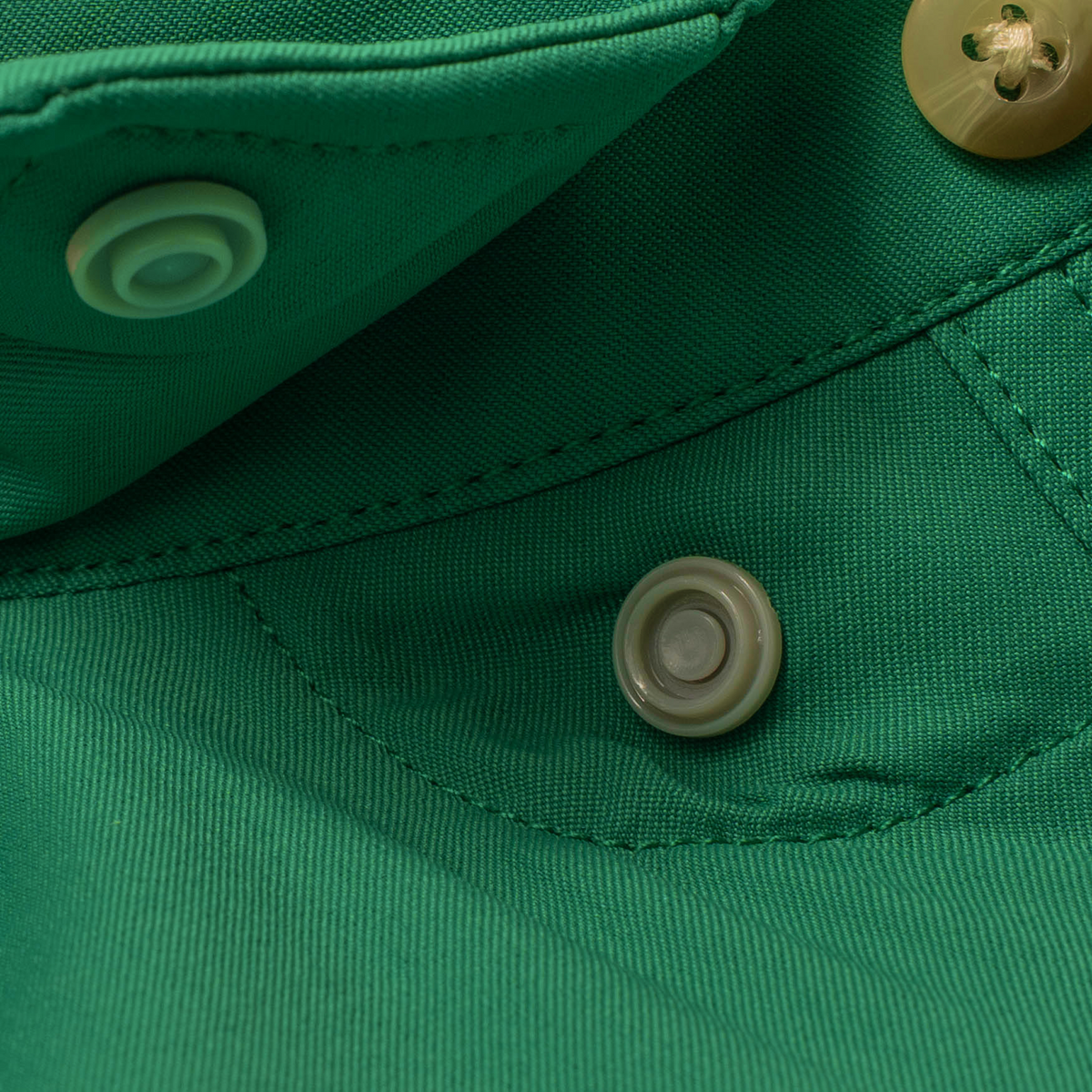 collar snaps on green shirt