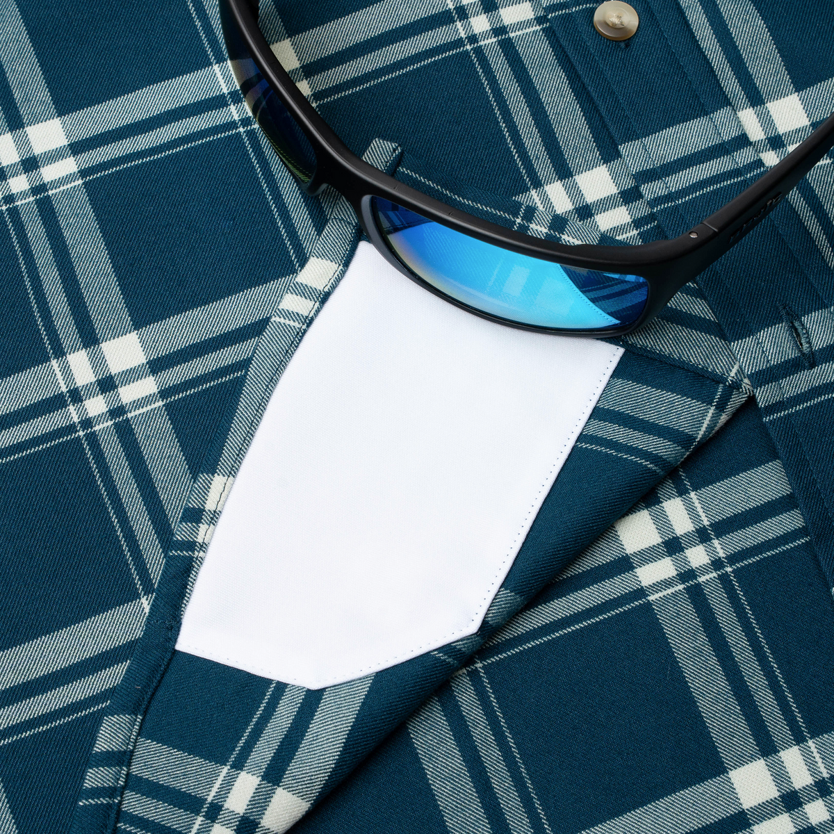 sunglasses with lens cleaner on shirt