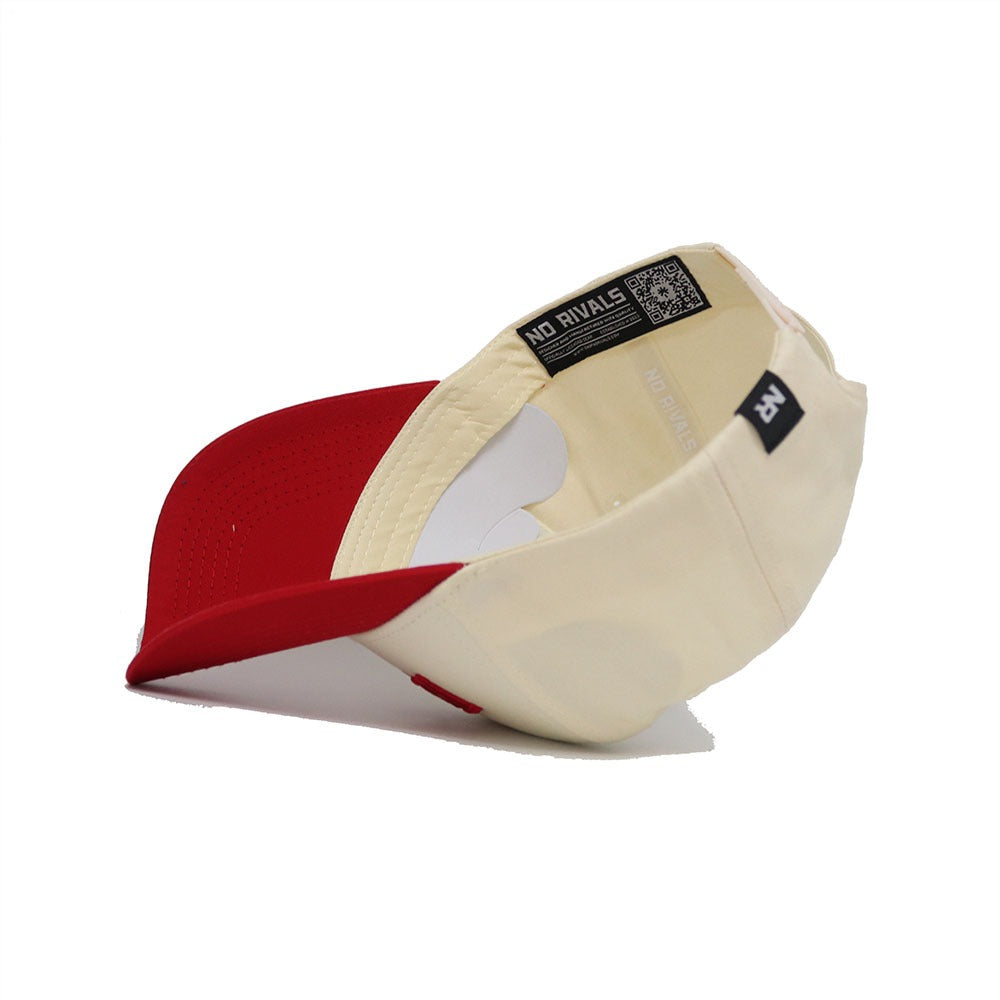 An Arkansas Razorback Hat by No Rivals is shown upside down, revealing inner labels and stitching. The tag displays “NO RIVALS” with a QR code on the band—a perfect Gameday Fit for fans.