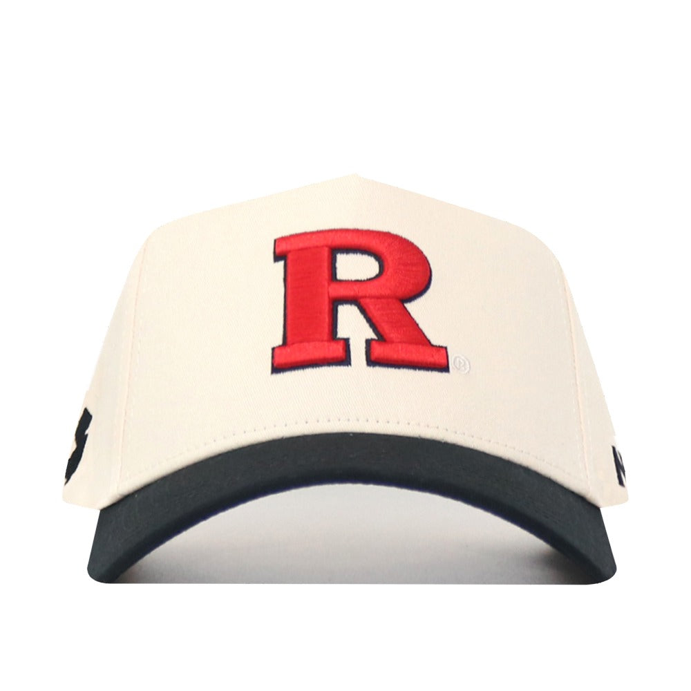The No Rivals Classic Rutgers Hat (B2B) is a cream cotton baseball cap with a bold red "R" on the front and a black brim, displayed from the front.