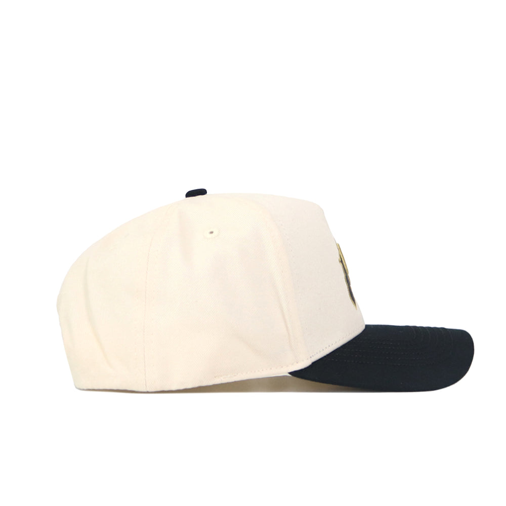 The Classic Colorado Buffs Hat is a structured white baseball cap with a black brim, made from high quality cotton, shown from the side on a plain white background.