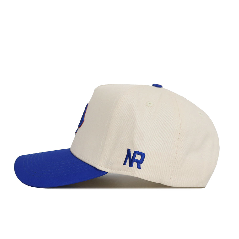 The No Rivals Classic Boise State Hat (B2B) features a cream color, blue brim, and blue "NR" embroidery on the side—an ideal snapback for your gameday outfit.