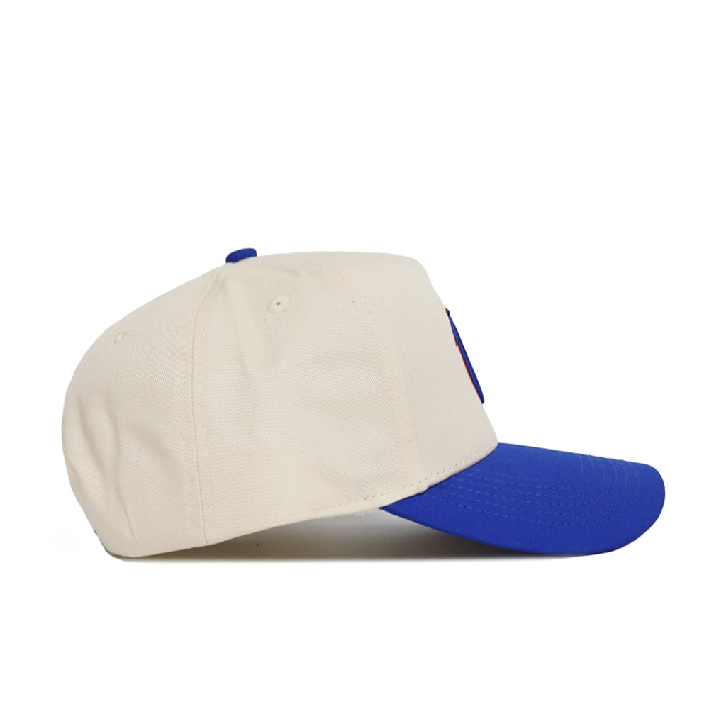 A side view of the No Rivals Classic Boise State Hat (B2B) in beige with a bright blue brim, shown on a white background—an ideal pick to complete your gameday look.