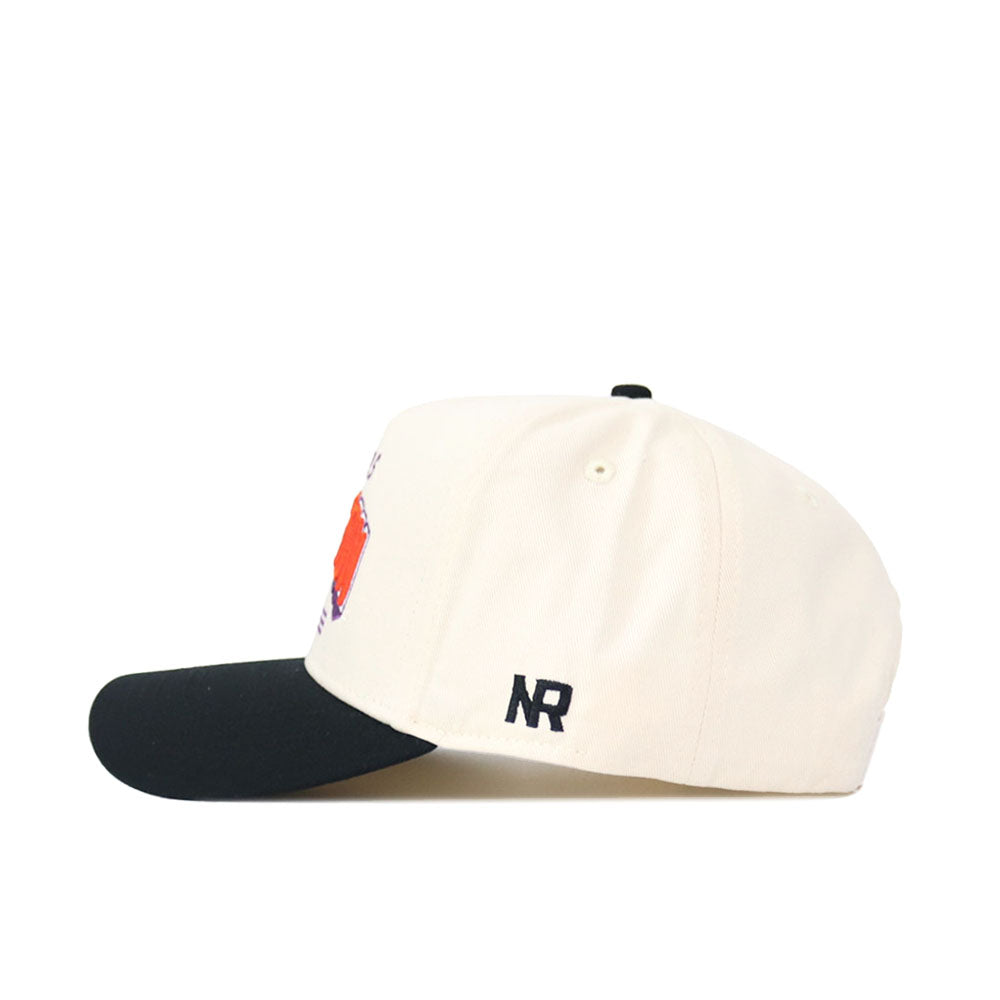 The Clemson Letterman Hat by No Rivals is shown in a side view. It features a white structured fit, black brim, embroidered NR letters in black on the left near the back, and a snap back closure for easy adjustment.