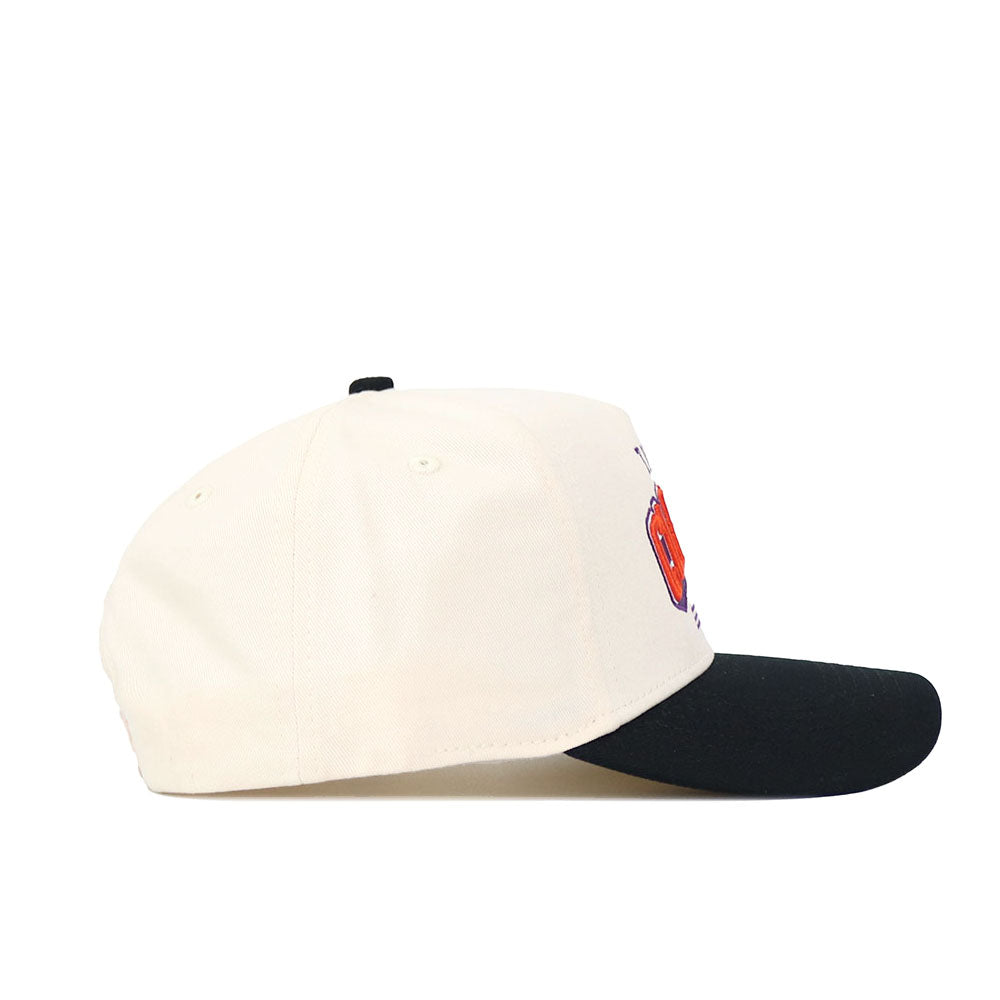 The No Rivals Clemson Letterman Hat features a cream crown and black brim, seen from the side. Made of high-quality cotton, it has red and black embroidered details on the structured front panel.