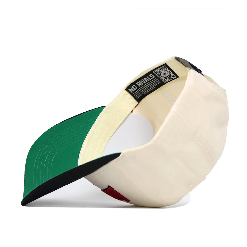 The Arkansas Ballpark Hat by No Rivals is a cream-colored, officially licensed cap with a green underbrim, shown upside down to reveal interior labels, black sweatband, and a QR code tag inside the high-quality cotton construction.