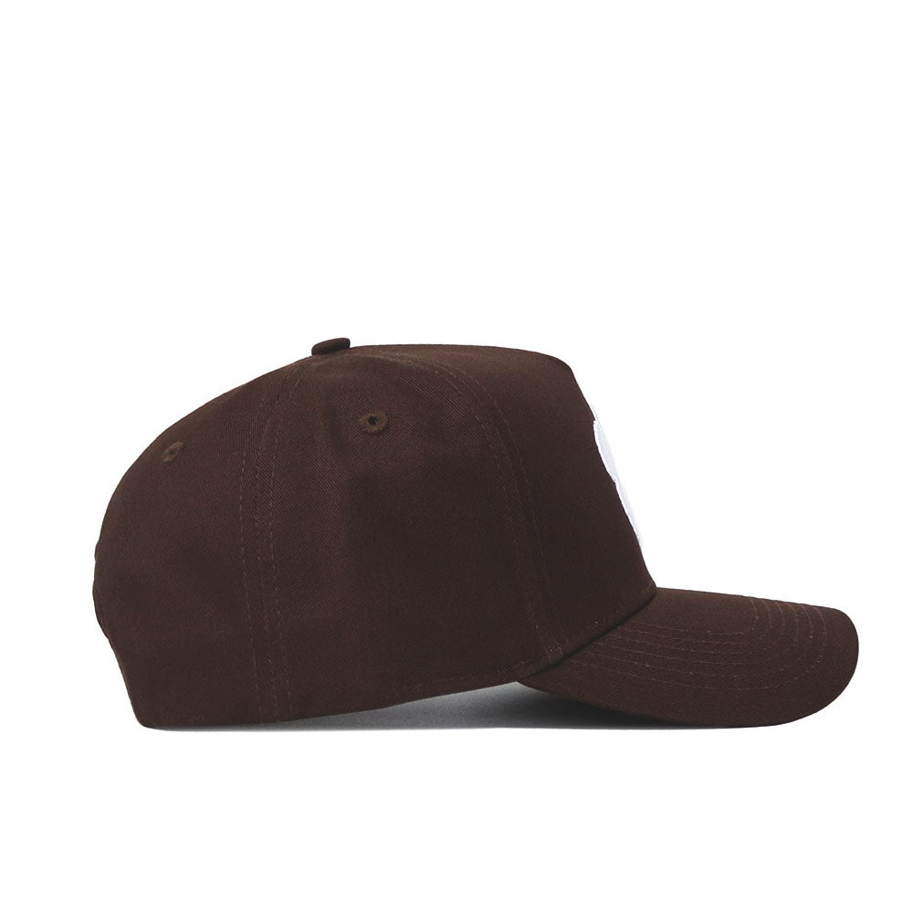 The Clemson Americano Hat, a high-quality cotton baseball cap in plain brown, is shown from the side on a white background. It features a curved brim, top button, and a structured fit for comfort and style.