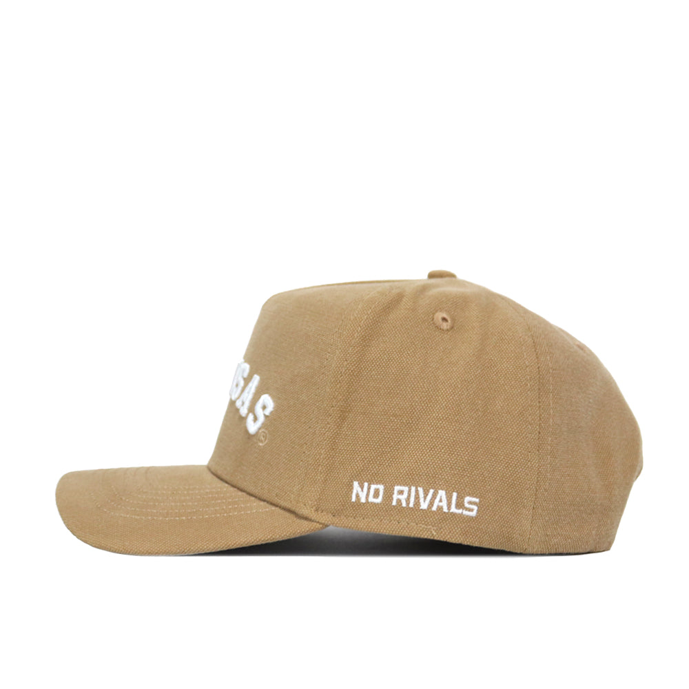 The Arkansas Rustic Hat is a tan cotton-canvas snapback with a structured fit, flat brim, and white embroidered "NO RIVALS" on the side plus partially visible white text on the front.