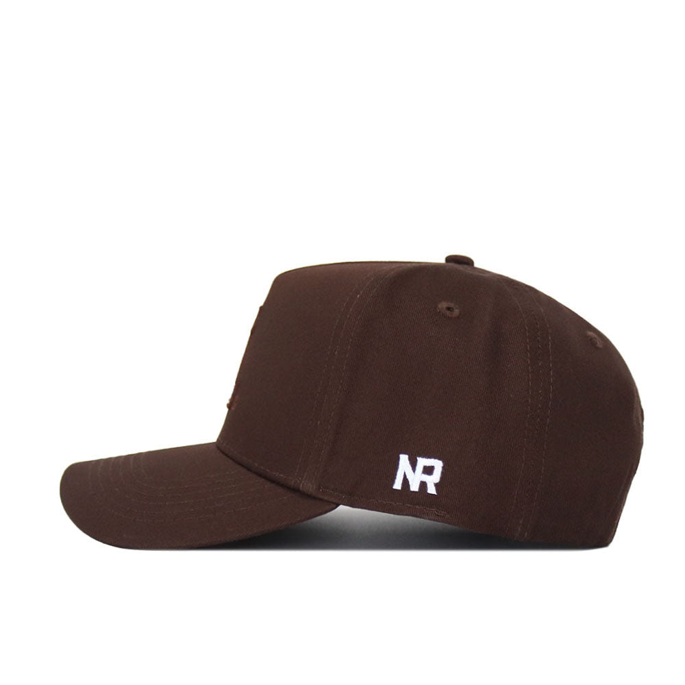 The App State Americano Hat is a dark brown cotton baseball cap, shown in side view, with a structured fit and white embroidered NR initials above the brim.