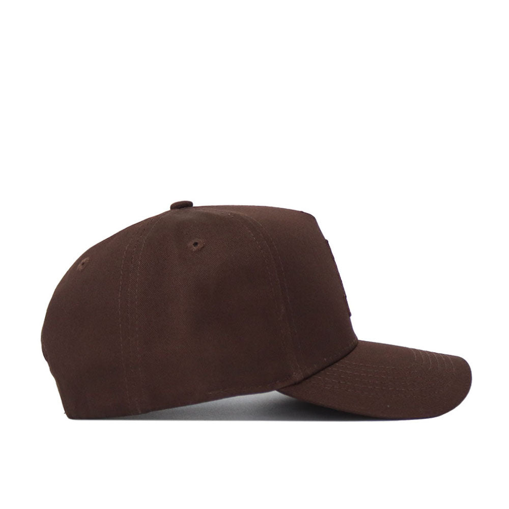 The App State Americano Hat, a brown cotton baseball cap with a curved brim and no visible logos or decorations, is shown from the side on a white background.