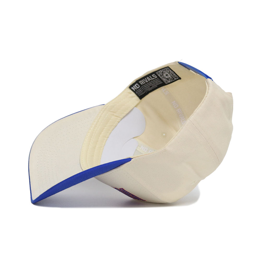 The Boise State Retro Block Hat - Classic Colors by No Rivals is a cream cotton cap with a blue brim. Seen from inside, the inner band repeats "NO RIVALS," and a QR code appears on the inner label.