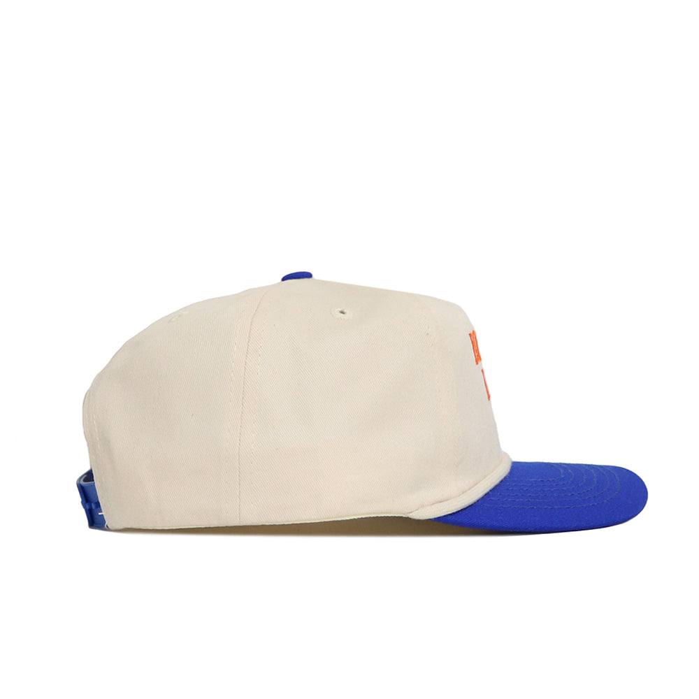The No Rivals Boise State Old School Hat (B2B) is a cream baseball cap with a blue brim, unstructured fit, and blue snapback, shown in left side profile against a white background.