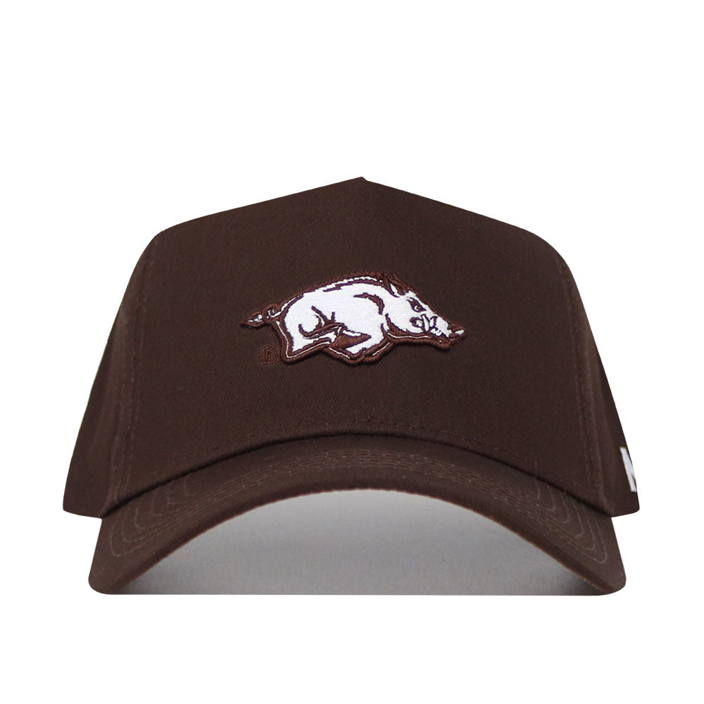 The Arkansas Americano Hat is a high-quality cotton brown snapback with a white and maroon embroidered hog logo, officially licensed to represent the Arkansas Razorbacks in comfort and style.
