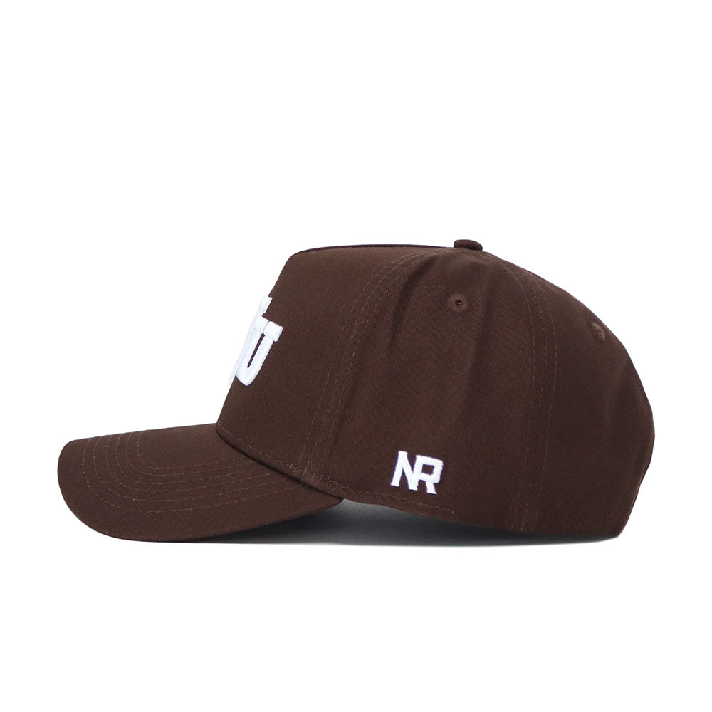 The BYU Americano Hat is a brown, structured-fit baseball cap made from high-quality cotton. It features white embroidered lettering on the front and “NR” stitched near the back, shown from a side view.