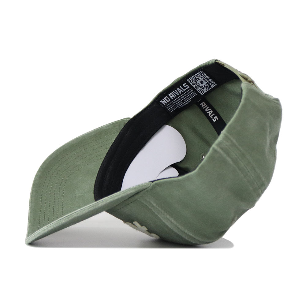 The Arkansas Home Turf Hat is shown inside out, displaying its black inner band with white NO RIVALS text and a QR code label. Its green structured build, curved brim, and adjustable strap are clearly visible.