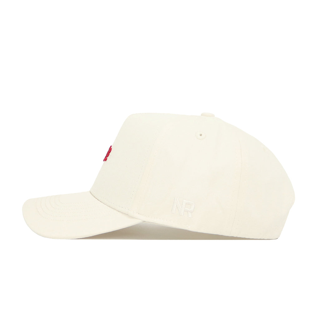 The No Rivals Arkansas Sideline Hat is a cream-colored baseball cap made from high-quality cotton, with white embroidered NR initials on the side and a small red front design.