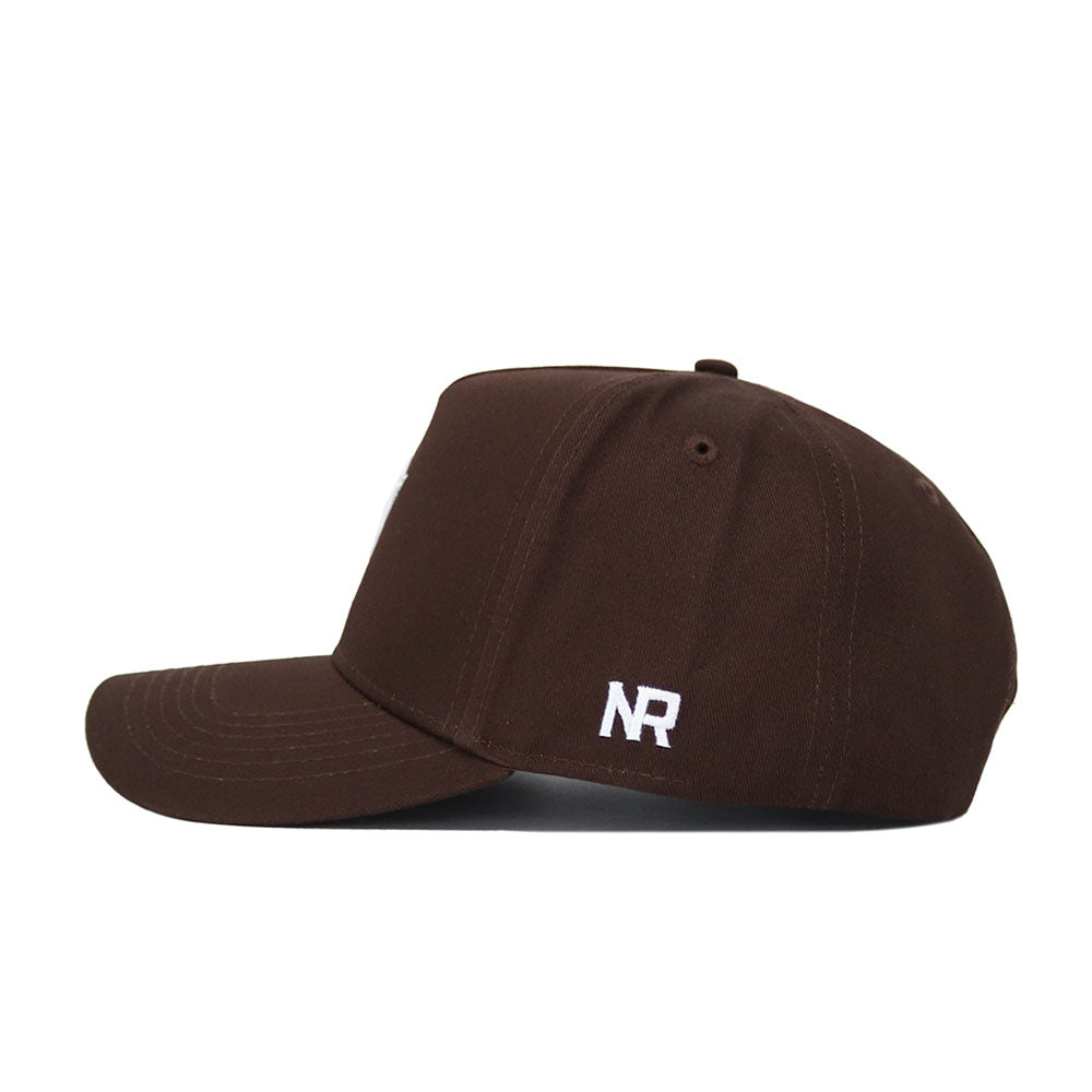 The Arizona State Americano Hat is a brown cotton baseball cap with a curved brim, shown from the side. It features white embroidered “NR” near the back and offers a comfortable, structured fit.
