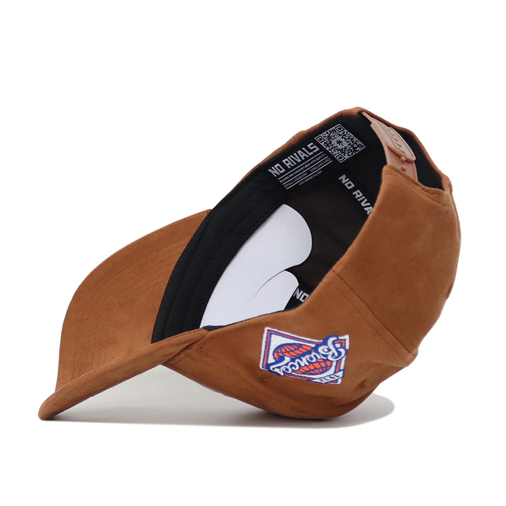 The Boise State Heritage Hat by No Rivals is a brown suede baseball cap, shown inside out to display the inner No Rivals label and features a colorful embroidered "93 World" patch on the front panel.