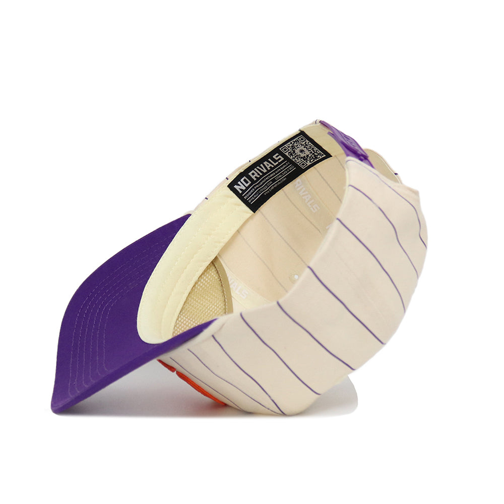 The Clemson Pinstripe Hat by No Rivals is a cream-colored snapback with purple pinstripes and a purple brim. Shown upside down, it reveals the NO RIVALS label and internal panels, crafted from high quality cotton for lasting comfort and style.
