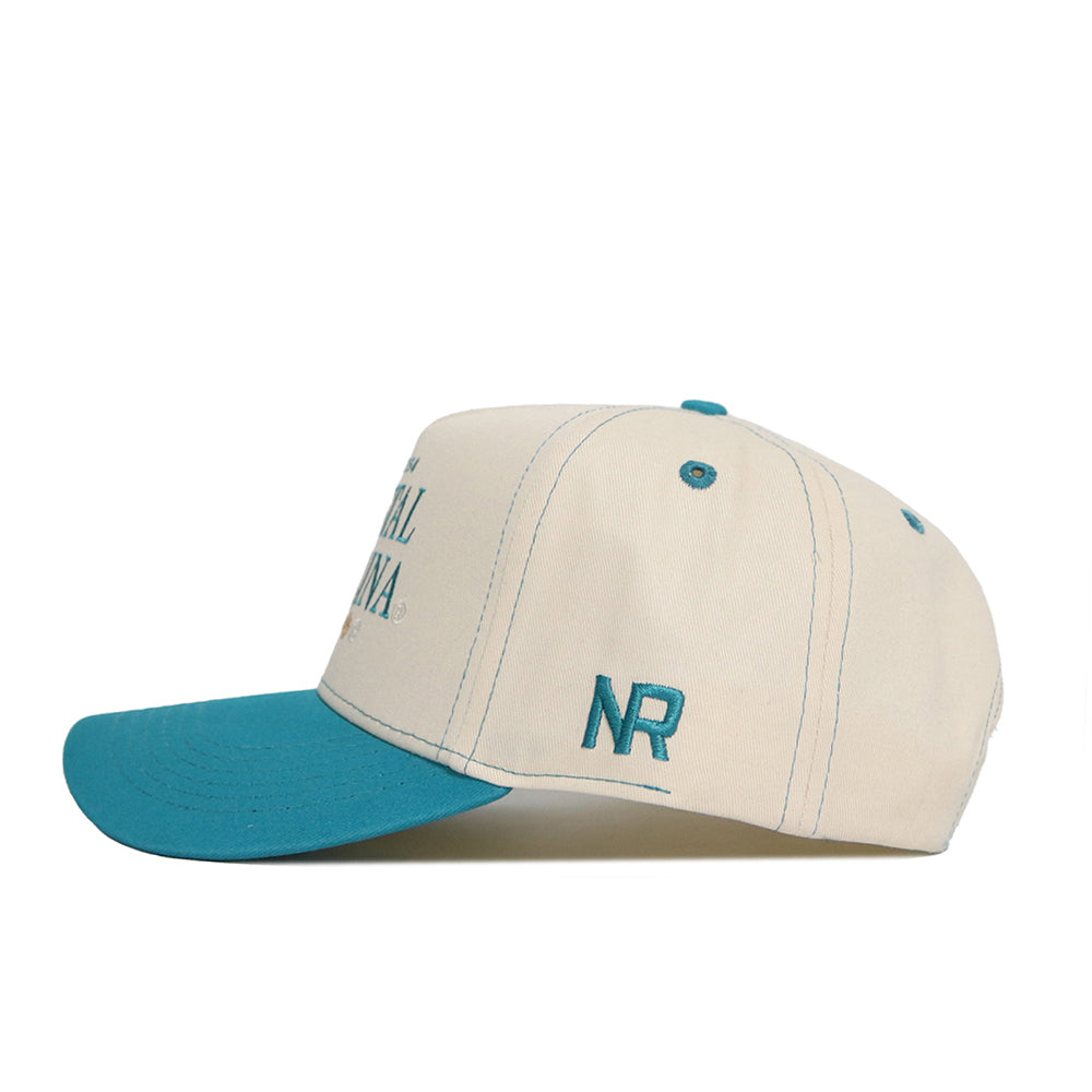 The No Rivals Coastal Carolina Vintage Hat is a beige snapback with a teal brim, teal embroidered NR letters on the side, and made from high-quality cotton for a structured fit and lasting style.