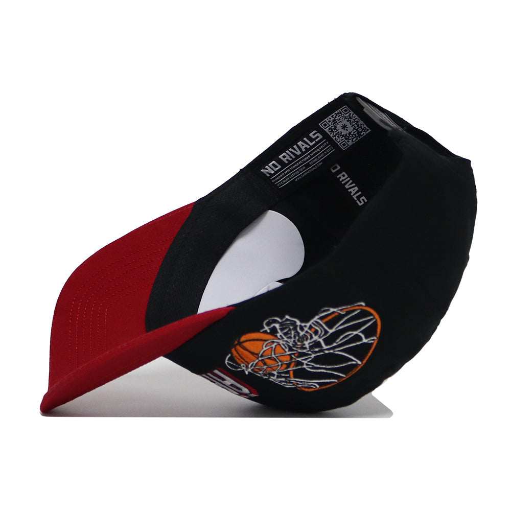 The Arkansas Courtside Hat is a black and red snapback featuring an embroidered basketball player in action, side view, with inside labels, a red brim, structured fit, and high-quality cotton construction.