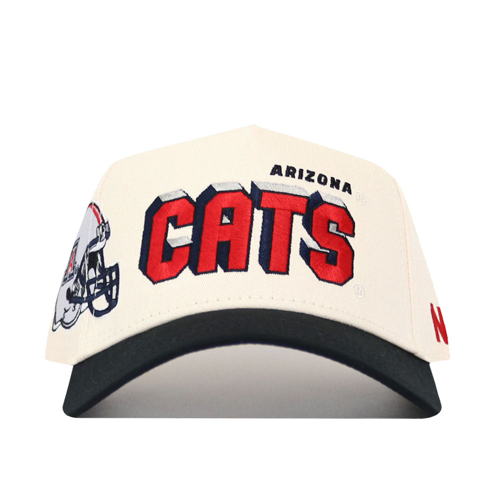 The Arizona Alma Mater Hat - Classic by No Rivals is a white snapback featuring “ARIZONA CATS” in bold red and blue, a football helmet graphic on the left brim, and made from high-quality cotton for a structured fit.