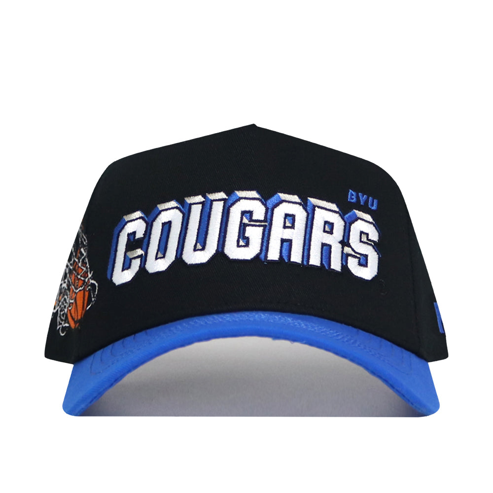 The BYU Courtside Hat is a black and blue snapback with COUGARS in bold white letters, BYU above, and a basketball net graphic on the brim. Made from high-quality cotton, this hat is officially licensed for true fans.